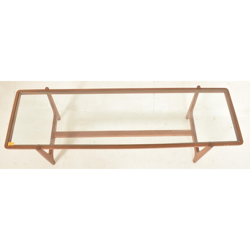 516 - A retro 20th century glass & teak wood long john low occasional coffee table. The table having a... 