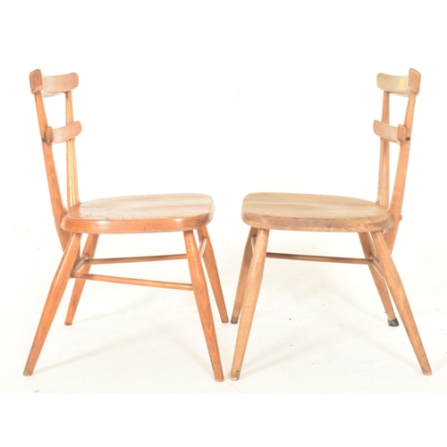 524 - A set a four retro mid 20th century circa 1960s oak wood children's fan back school chairs. Ecach ch... 