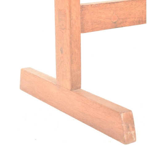 528 - A retro mid 20th century teak wood towel / clothes rack stand. The rak having two top supports, rais... 