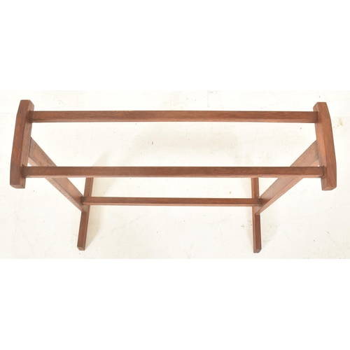 528 - A retro mid 20th century teak wood towel / clothes rack stand. The rak having two top supports, rais... 