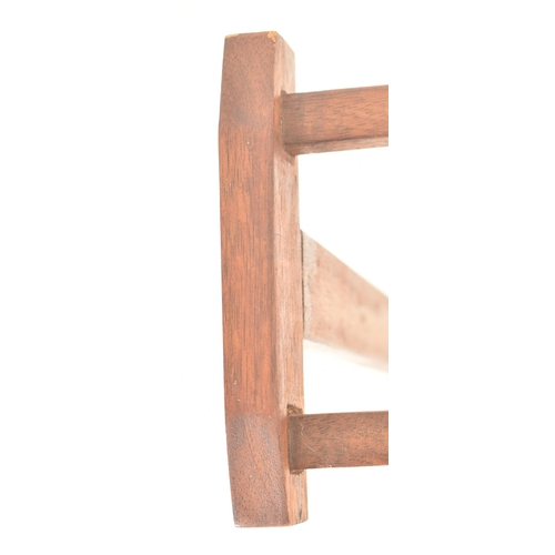 528 - A retro mid 20th century teak wood towel / clothes rack stand. The rak having two top supports, rais... 