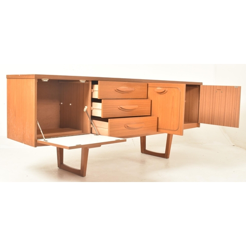 539 - Stonehill Furniture - a vintage mid 20th century teak veneered sideboard. The sideboard featuring th... 