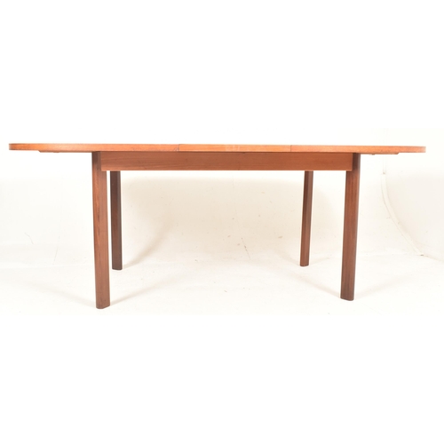 541 - Victor Wilkins for G-Plan Furniture - a vintage mid century 1960s teak extending dining table. The d... 