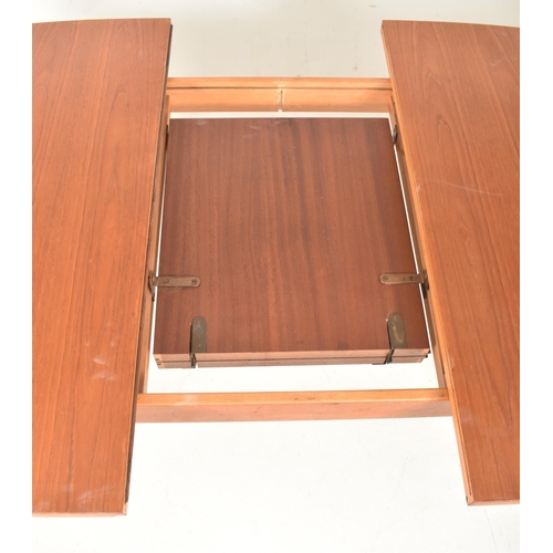 541 - Victor Wilkins for G-Plan Furniture - a vintage mid century 1960s teak extending dining table. The d... 