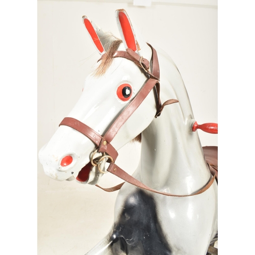 549 - Ragamuffin Toys Ltd. of Guernsey - a vintage 20th century grey painted rocking horse. The horse in a... 