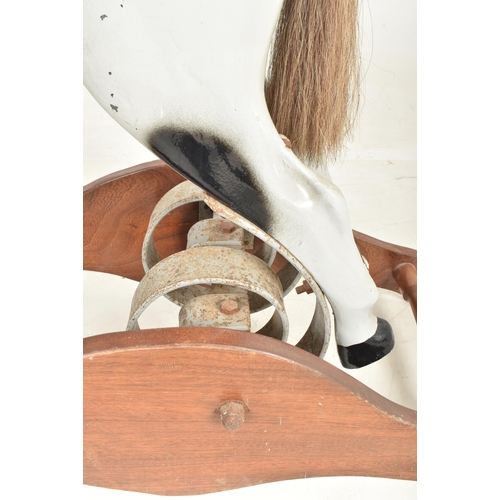 549 - Ragamuffin Toys Ltd. of Guernsey - a vintage 20th century grey painted rocking horse. The horse in a... 