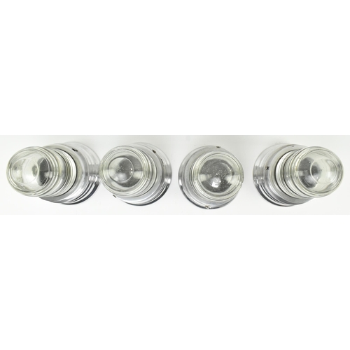 561 - A set of four retro 20th century chrome metal & glass bulkhead wall lights. Each having a circul... 