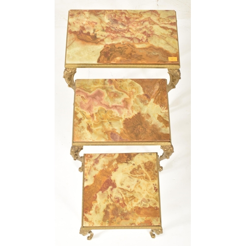 565 - A retro 1980s Hollywood Regency style nest of three marble and gilt metal Rococo tables. Each table ... 