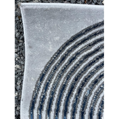 566 - 'Think Rugs' - a Modern Designer floor carpet rug. The rug having a grey ground with patterned blue ... 