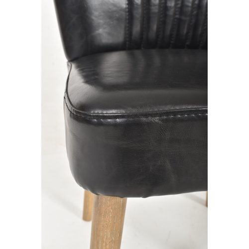 567 - A British Modern Design 20th century sky black leather & wooden cocktail lounge easy chair. The ... 