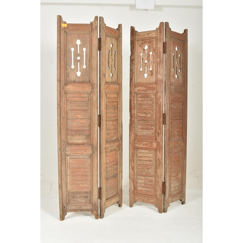 586 - A two-part / fourfold 20th century hardwood shutters / room divider screen. Upright form with panele... 