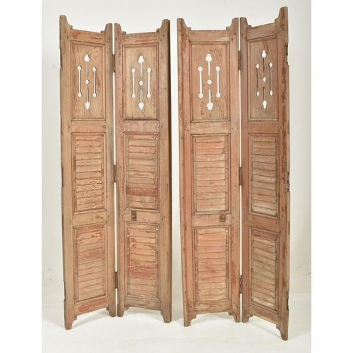 586 - A two-part / fourfold 20th century hardwood shutters / room divider screen. Upright form with panele... 