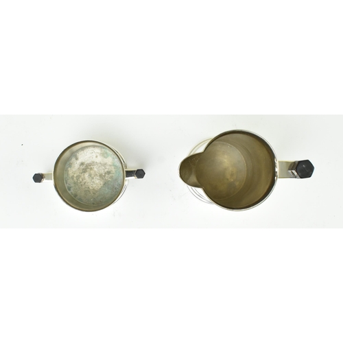 59 - Trench art military interest - a vintage mid century four piece tea service formed from reclaimed WW... 