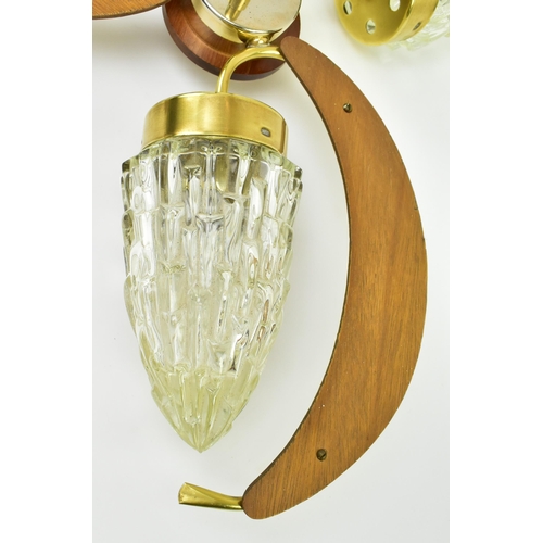 595 - A retro mid 20th century teak and brass hanging chandelier ceiling light. The light having propeller... 