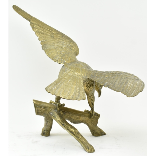 596 - A vintage early 20th century large table top eagle sculpture. The bird sculpture figured standing on... 