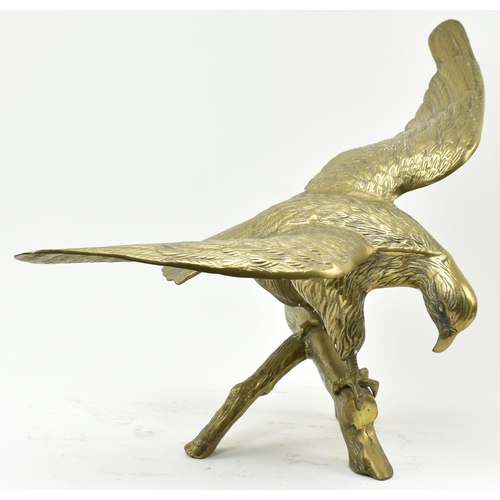 596 - A vintage early 20th century large table top eagle sculpture. The bird sculpture figured standing on... 