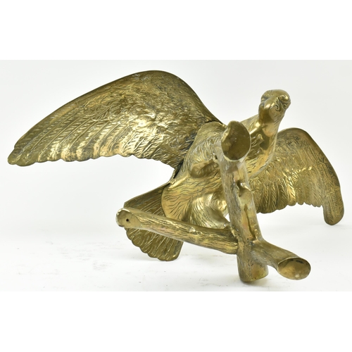 596 - A vintage early 20th century large table top eagle sculpture. The bird sculpture figured standing on... 