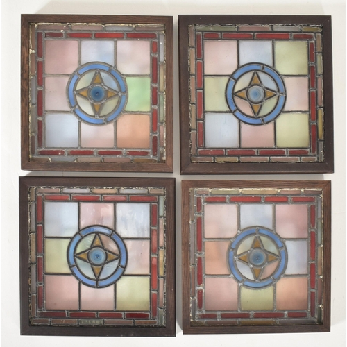 598 - Four vintage mid century decorative stained glass windows. The window panels each featuring geometri... 