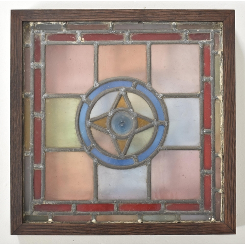 598 - Four vintage mid century decorative stained glass windows. The window panels each featuring geometri... 