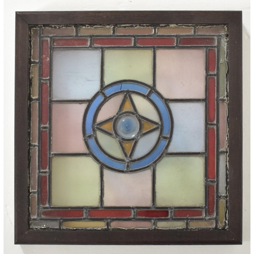 598 - Four vintage mid century decorative stained glass windows. The window panels each featuring geometri... 