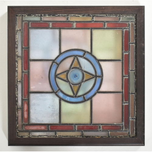 598 - Four vintage mid century decorative stained glass windows. The window panels each featuring geometri... 