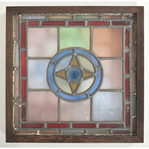 598 - Four vintage mid century decorative stained glass windows. The window panels each featuring geometri... 