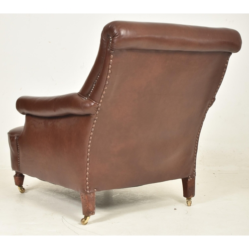 64 - A 20th century Art Deco influenced club armchair / library chair. The chair having scrolled arms and... 