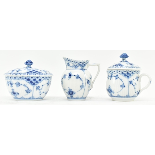 86 - A 1960s Royal Copenhagen porcelain blue fluted pattern part tea service. The lot comprising a hot wa... 