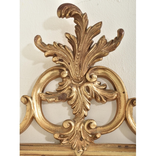 292 - Veronese product - a vintage 20th century burnished gilt effect Rococo style wall mirror. The mirror... 