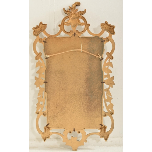 292 - Veronese product - a vintage 20th century burnished gilt effect Rococo style wall mirror. The mirror... 