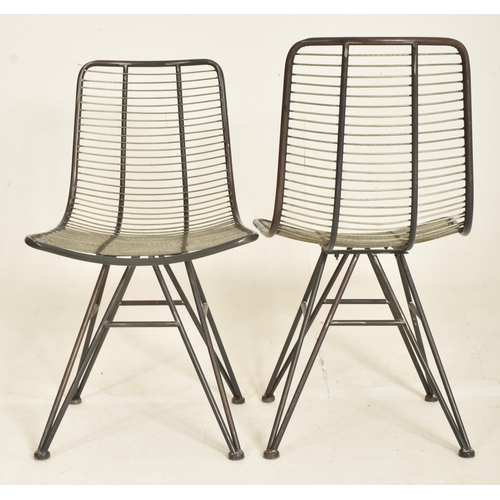 327 - A set of four modern designer metal and wire worked dining chairs / cafe chairs. Each having tubular... 