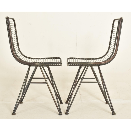 327 - A set of four modern designer metal and wire worked dining chairs / cafe chairs. Each having tubular... 