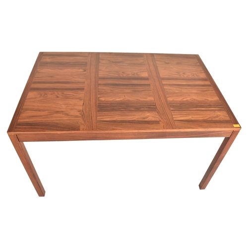 556 - WITHDRAWN - Vejle Stole - a vintage mid century Danish design rosewood extending dining table. The t... 