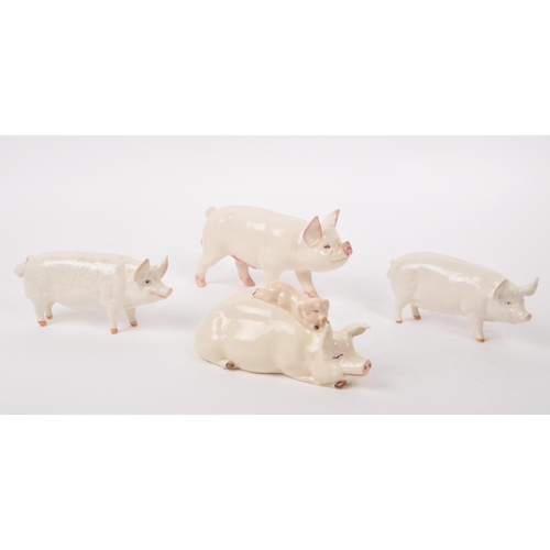 10 - Beswick - A collection of four 20th century porcelain farm animal pigs, comprising of 'CH Wall Queen... 