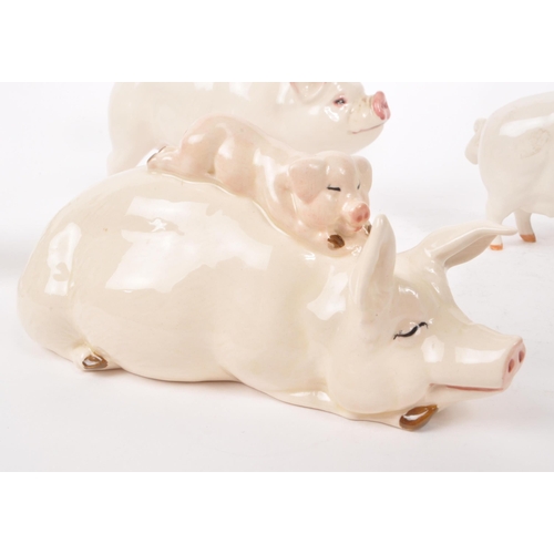 10 - Beswick - A collection of four 20th century porcelain farm animal pigs, comprising of 'CH Wall Queen... 