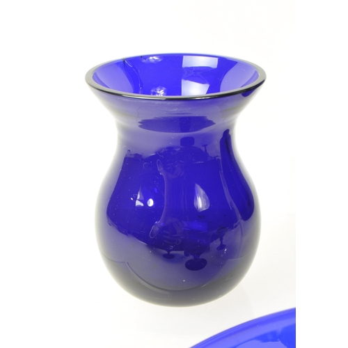 101 - A collection of 20th century Bristol blue studio art glass. The collection to include jugs, vases, b... 