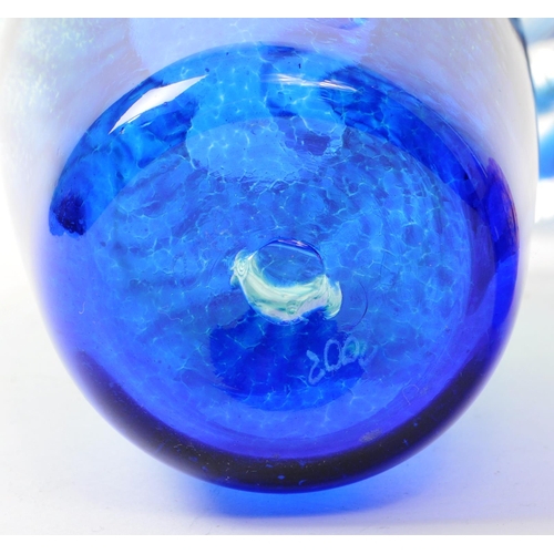 104 - Caithness - A modern dolphin glass vase having a streak of blue depicting water / waves. Together wi... 