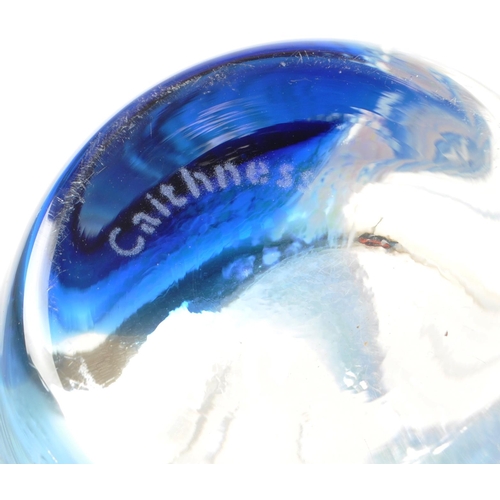 104 - Caithness - A modern dolphin glass vase having a streak of blue depicting water / waves. Together wi... 