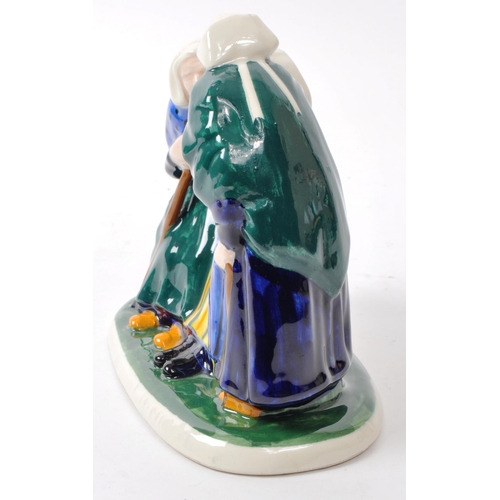 105 - Louis Henri Nicot (1878-1944) - Henriot Quimper pottery figure group, French, early 20th century, de... 