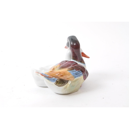 106 - Herend - A vintage 20th century Herend model 5036 porcelain duck figures. Each figure in the form of... 