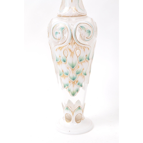 113 - A pair of 19th century Czech Bohemian glass vases. Each vase raised on a rounded base, with flared t... 