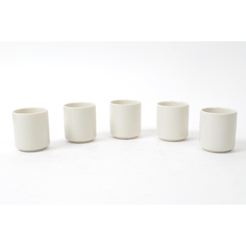 115 - A set of five mid-century Japanese Kabuki style sake / shot porcelain cups, housed within their orig... 