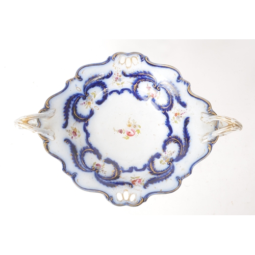 116 - An early 20th-century ceramic tazza / sweet dish, decorated with hand-painted blue and pink floral d... 