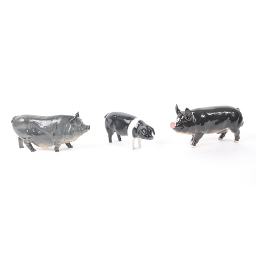 12 - Beswick - Royal Doulton - A collection of three 20th century porcelain pig figurines, comprising of,... 