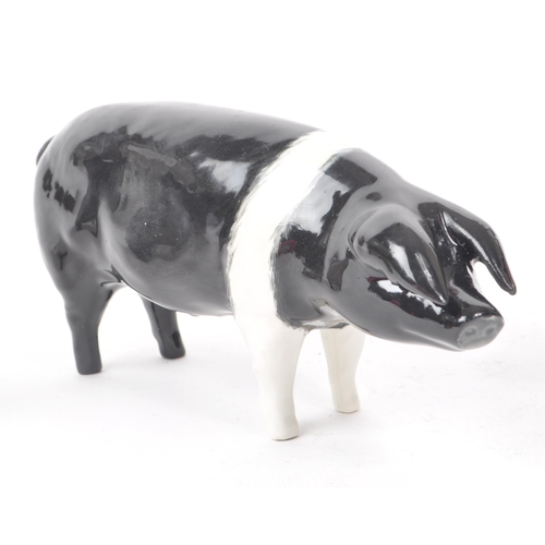 12 - Beswick - Royal Doulton - A collection of three 20th century porcelain pig figurines, comprising of,... 