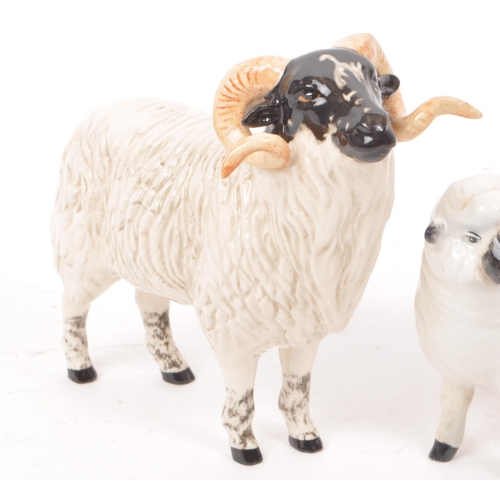 13 - Beswick - A collection of five 20th century sheep figurines, comprising of a ram, two sheep with hor... 