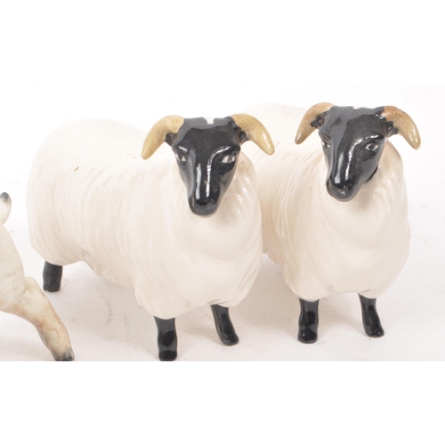 13 - Beswick - A collection of five 20th century sheep figurines, comprising of a ram, two sheep with hor... 