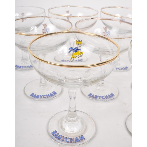 131 - Babycham - A collection of nine 20th Century circa 1970s vintage Babycham coupe glasses. With gilt r... 