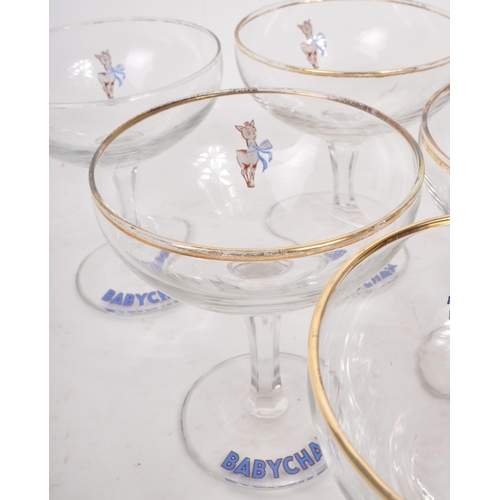 131 - Babycham - A collection of nine 20th Century circa 1970s vintage Babycham coupe glasses. With gilt r... 