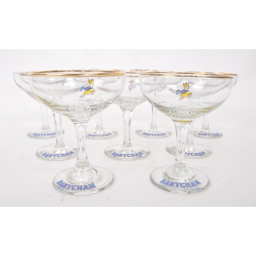 131 - Babycham - A collection of nine 20th Century circa 1970s vintage Babycham coupe glasses. With gilt r... 